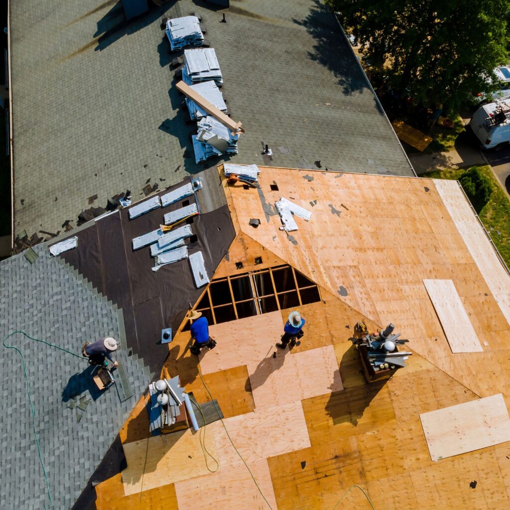 Aerial Drone Shot of Roofers Installing Asphalt Shingle Roof